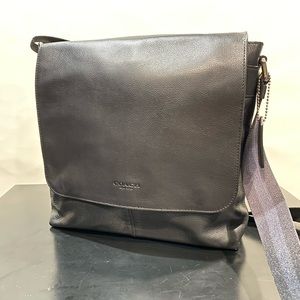 Coach men’s black leather side bag.